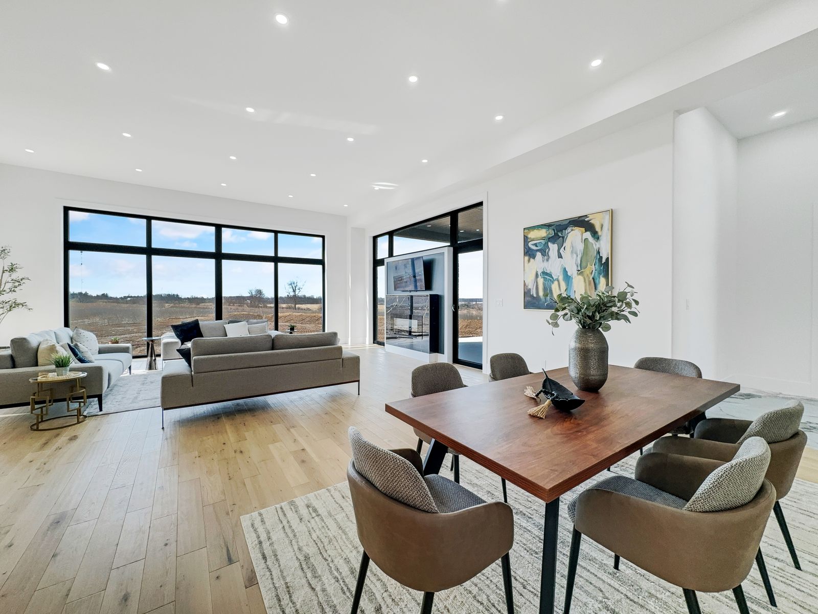 Open-concept living and dining in a completed Carnaby home